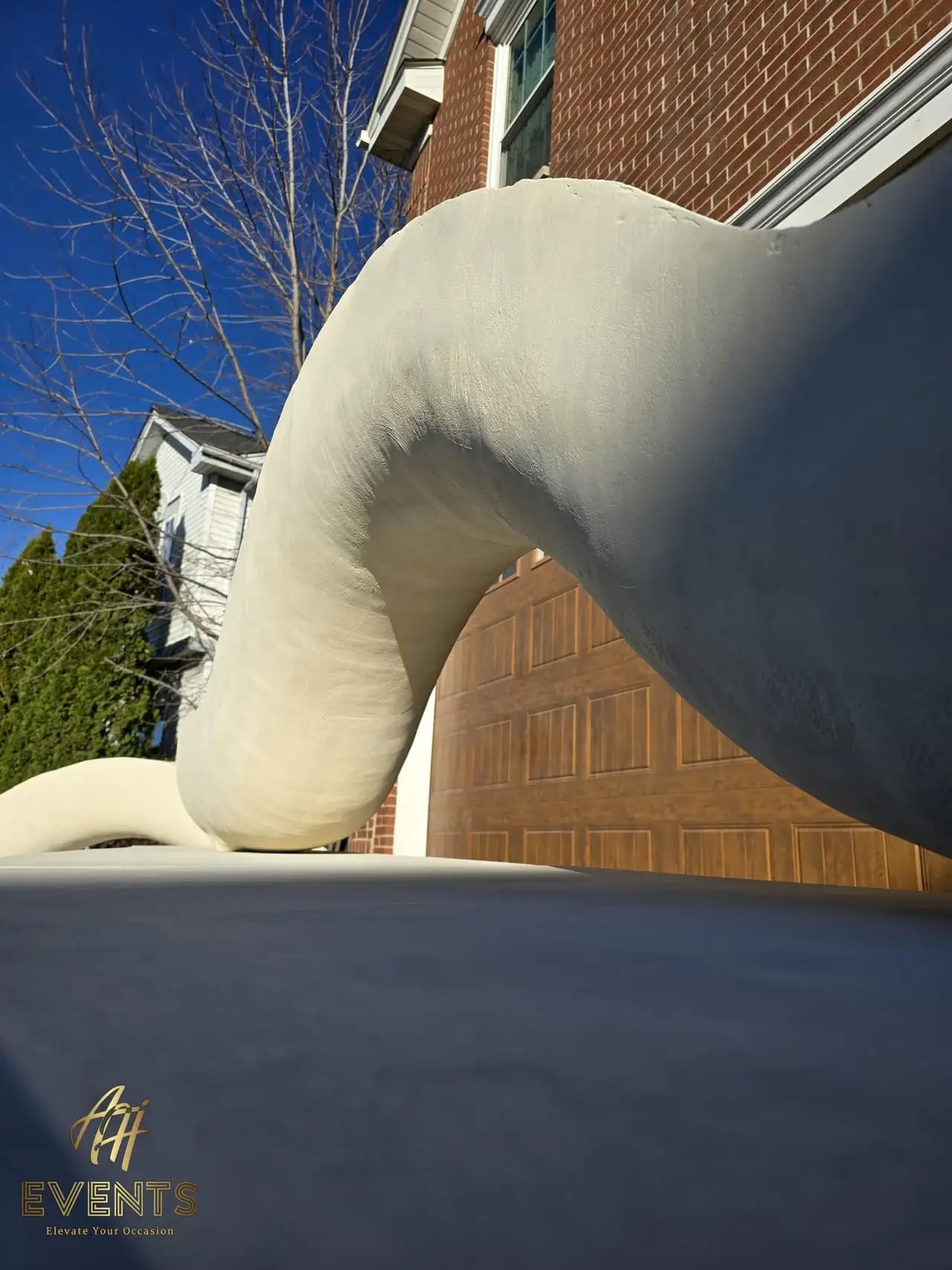 Classical Pillar Arch & Stage — a custom arch & contoured stage built by AH Crafted.