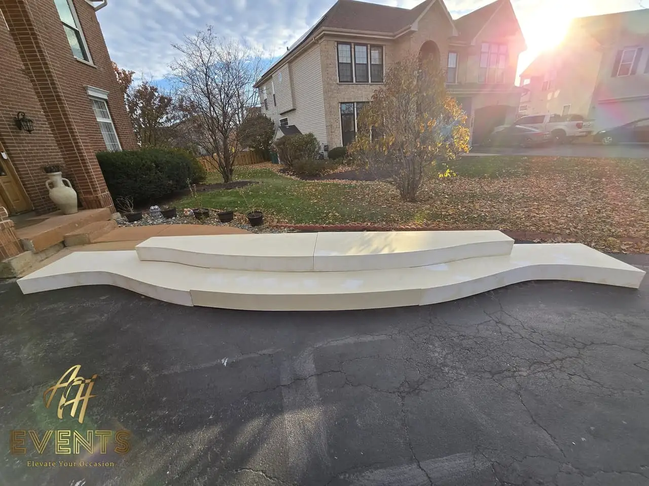 Classical Pillar Arch & Stage — a custom arch & contoured stage built by AH Crafted.