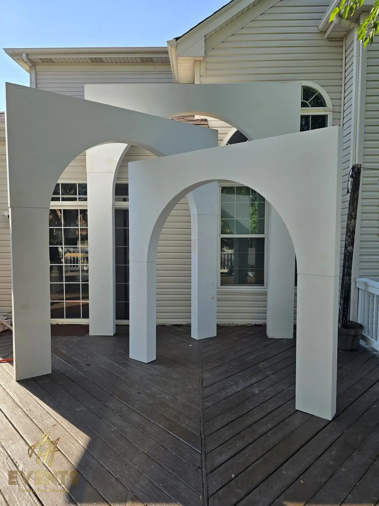 Volumetric Arc Suite — a custom sculptural backdrop built by AH Crafted.