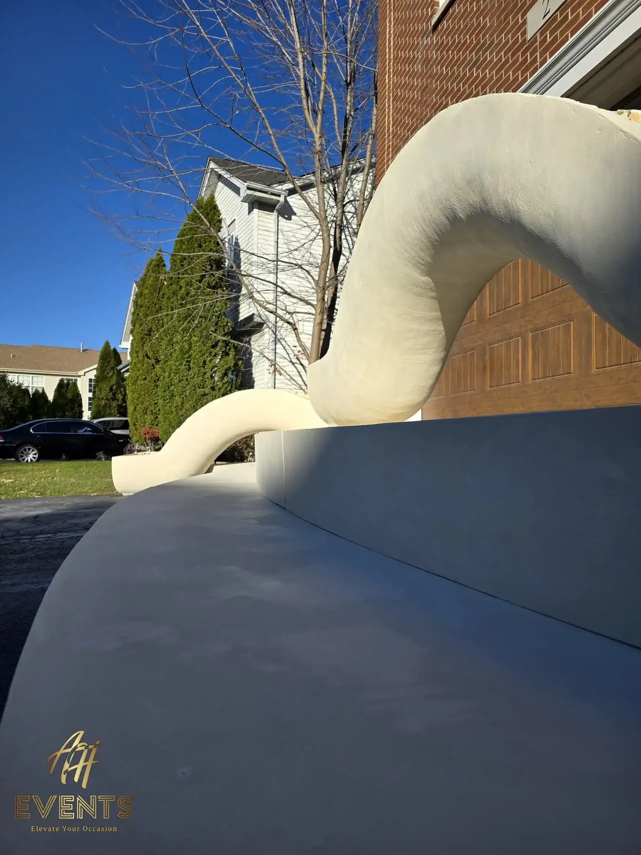 Classical Pillar Arch & Stage — a custom arch & contoured stage built by AH Crafted.