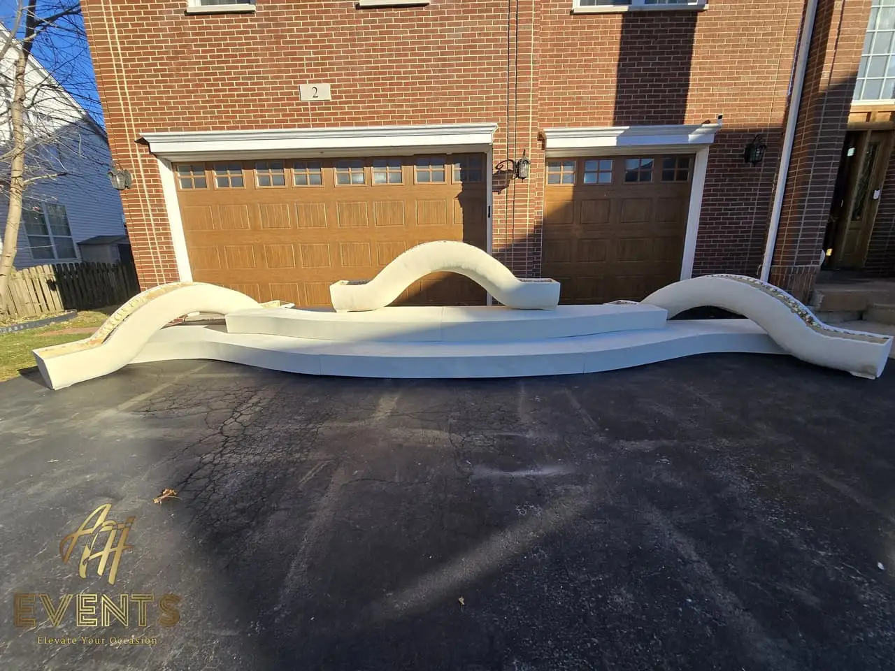 Classical Pillar Arch & Stage — a custom arch & contoured stage built by AH Crafted.