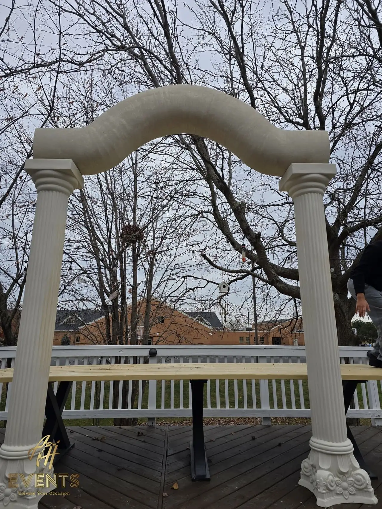 Classical Pillar Arch & Stage — a custom arch & contoured stage built by AH Crafted.