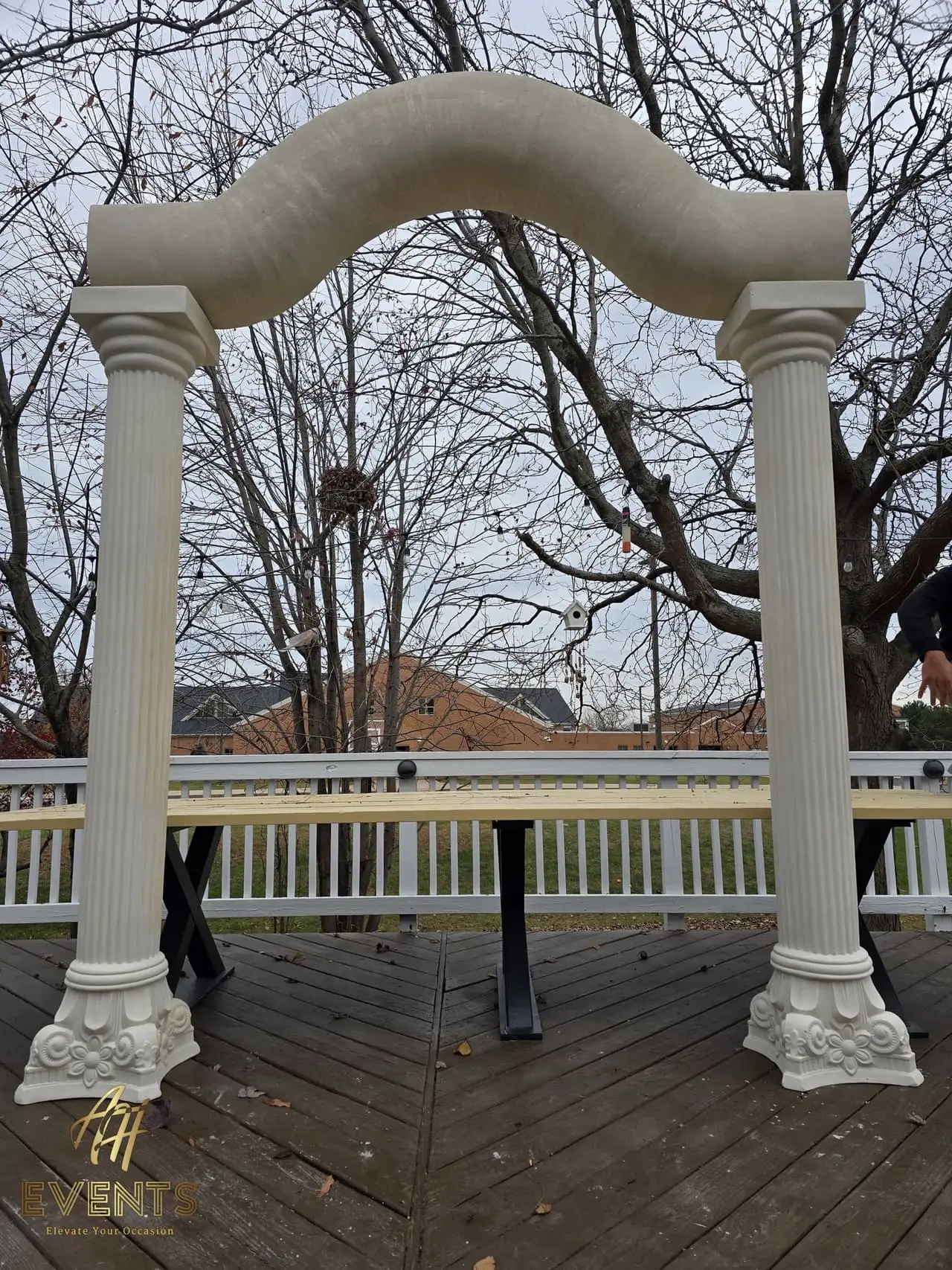 Classical Pillar Arch & Stage — a custom arch & contoured stage built by AH Crafted.