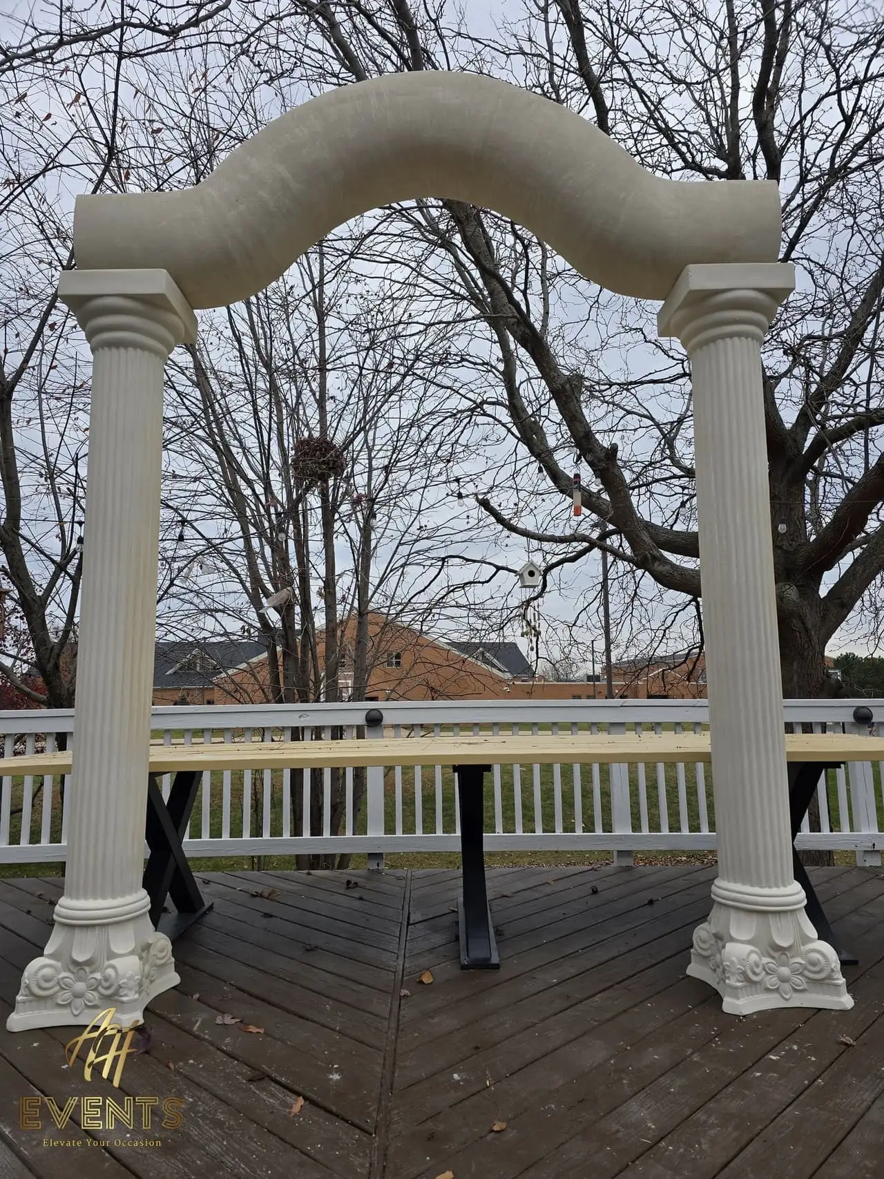 Classical Pillar Arch & Stage — a custom arch & contoured stage built by AH Crafted.