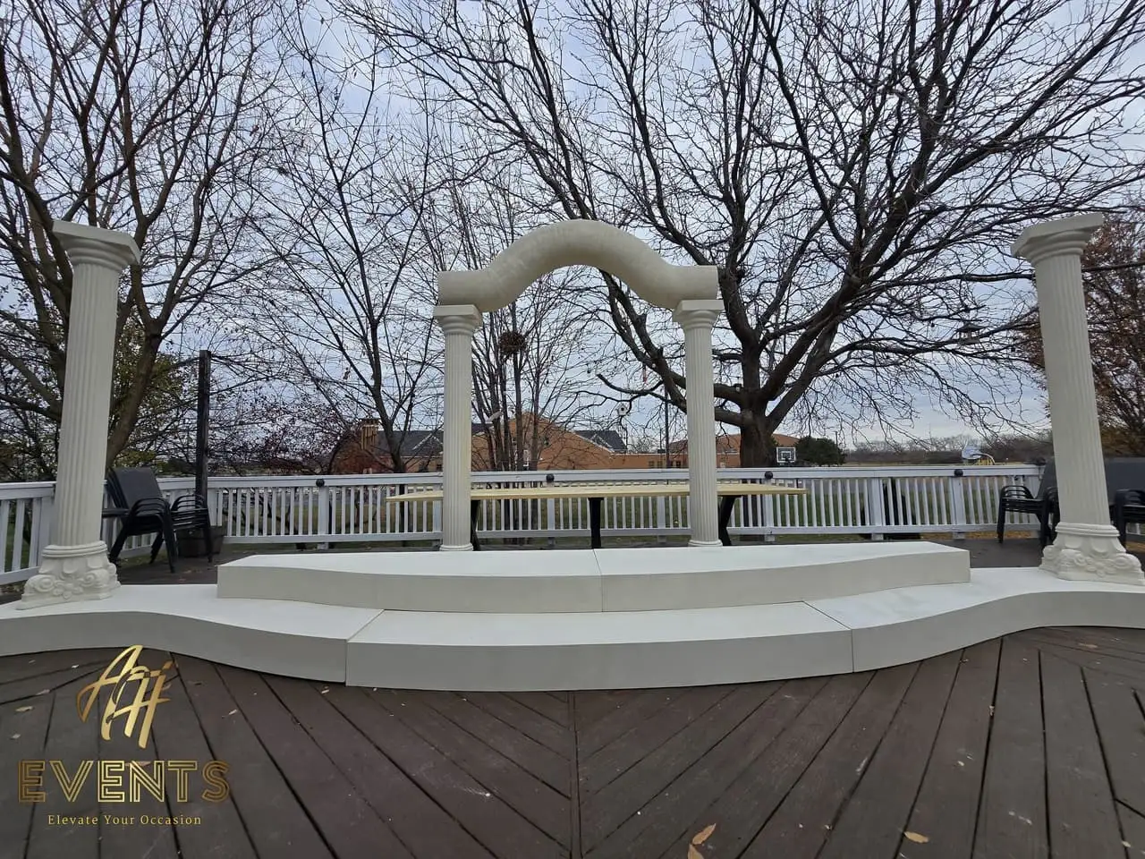 Classical Pillar Arch & Stage — a custom arch & contoured stage built by AH Crafted.