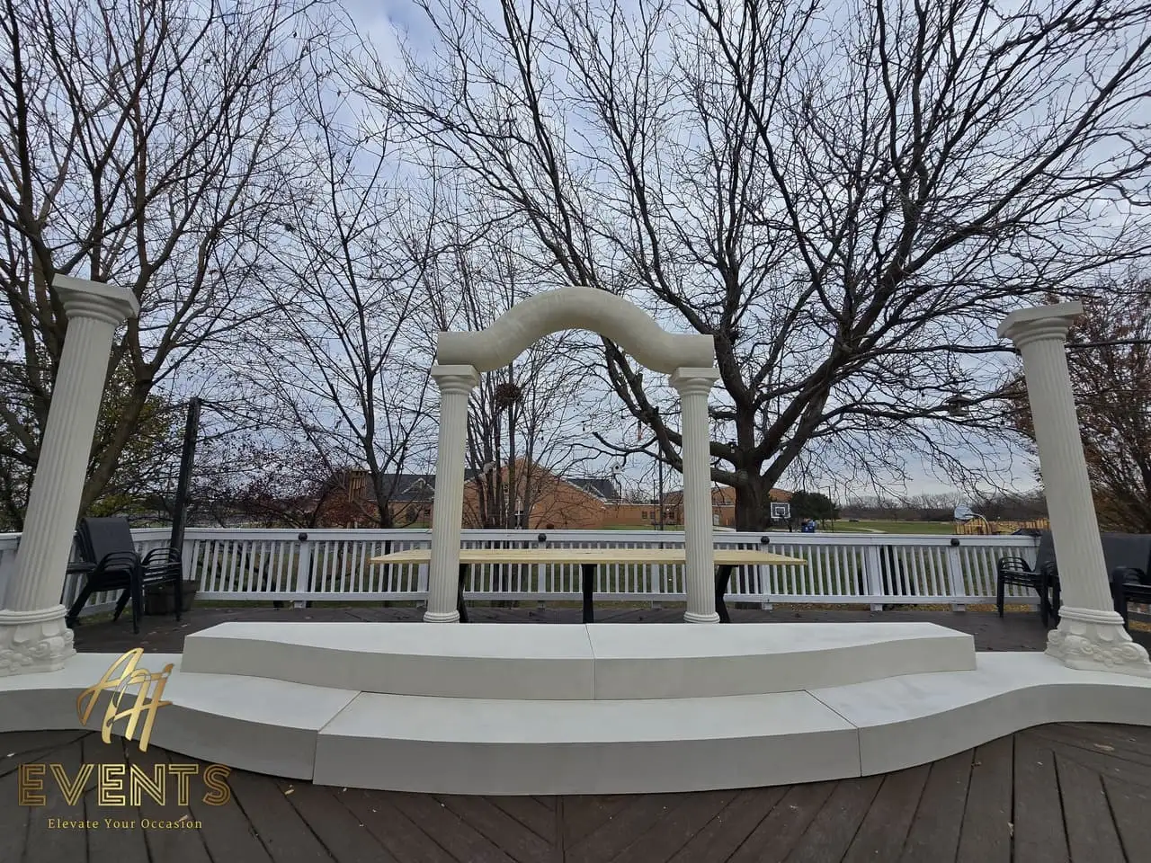 Classical Pillar Arch & Stage — a custom arch & contoured stage built by AH Crafted.